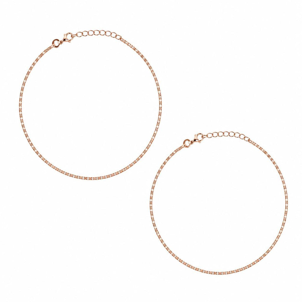 Two rose gold anklets with adjustable lobster clasp extensions, displayed on a clean white background.