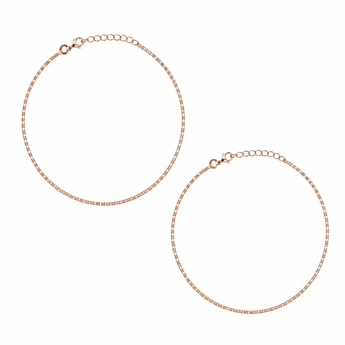 Two rose gold anklets with adjustable lobster clasp extensions, displayed on a clean white background.